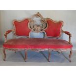 A Late 19th/Early 20th Century French Salon Sofa, the shaped carved pierced and partly upholstered