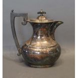 A Sheffield Silver Hot Water Pot with shaped ebonised handle, 21oz.