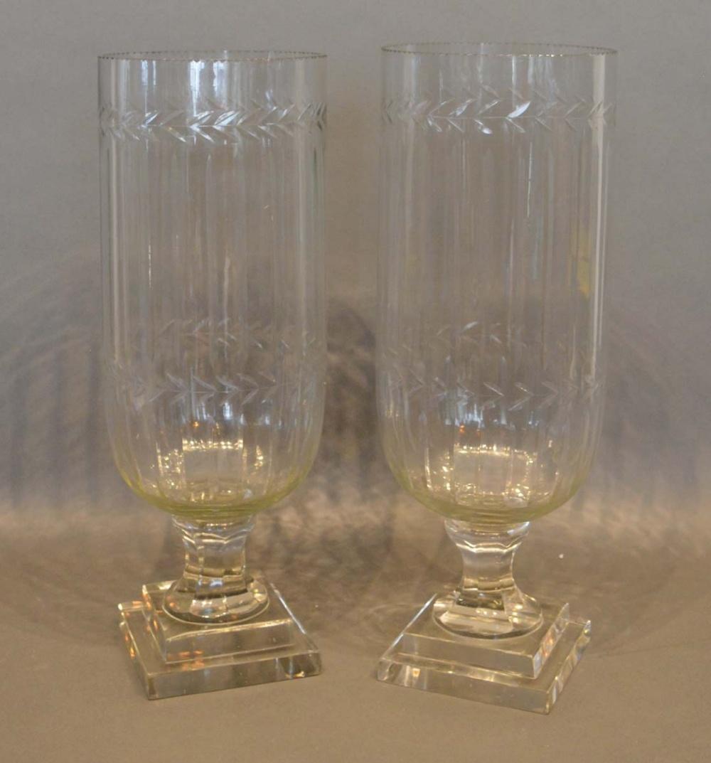 A Pair of Cut Glass Large Hurricane Lamps, each of fluted form with square stepped bases, 40cm tall