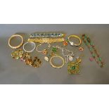 A Collection of Costume Jewellery to include bangles, bracelets, earrings and other items
