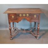 A George III Oak Lowboy, the moulded top above three frieze drawers with brass drop handles and