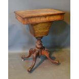 A Victorian Walnut Work Table, the crossbanded top above a frieze drawer and rectangular tapering