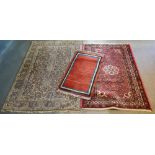 A North West Persian Style Woollen Rug with an allover design upon a red and cream ground within