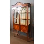 An Edwardian Mahogany Marquetry and Line Inlaid Display Cabinet with two glazed and inlaid doors