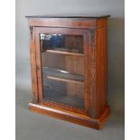 A Victorian Walnut Marquetry Inlaid and Gilt Metal Mounted Pier Cabinet with a glazed door enclosing