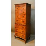 An Early 20th Century Burr Walnut Chest on Chest, the moulded top above seven drawers with