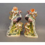 A Pair of Early 19th Century Staffordshire Spill Vases in the form of peacocks, 20cm tall