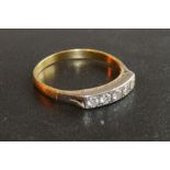 A Yellow Metal Five Stone Diamond Ring of band form
