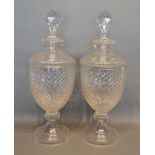 A Pair of Cut Glass Large Covered Vases of oviform with circular pedestal bases, 56cm tall