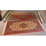 A North West Persian Style Woollen Rug with a central medallion within an allover design upon a red,