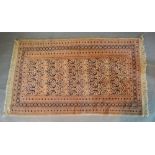 A North West Persian Woollen Rug with an allover design upon a cream and blue ground within multiple