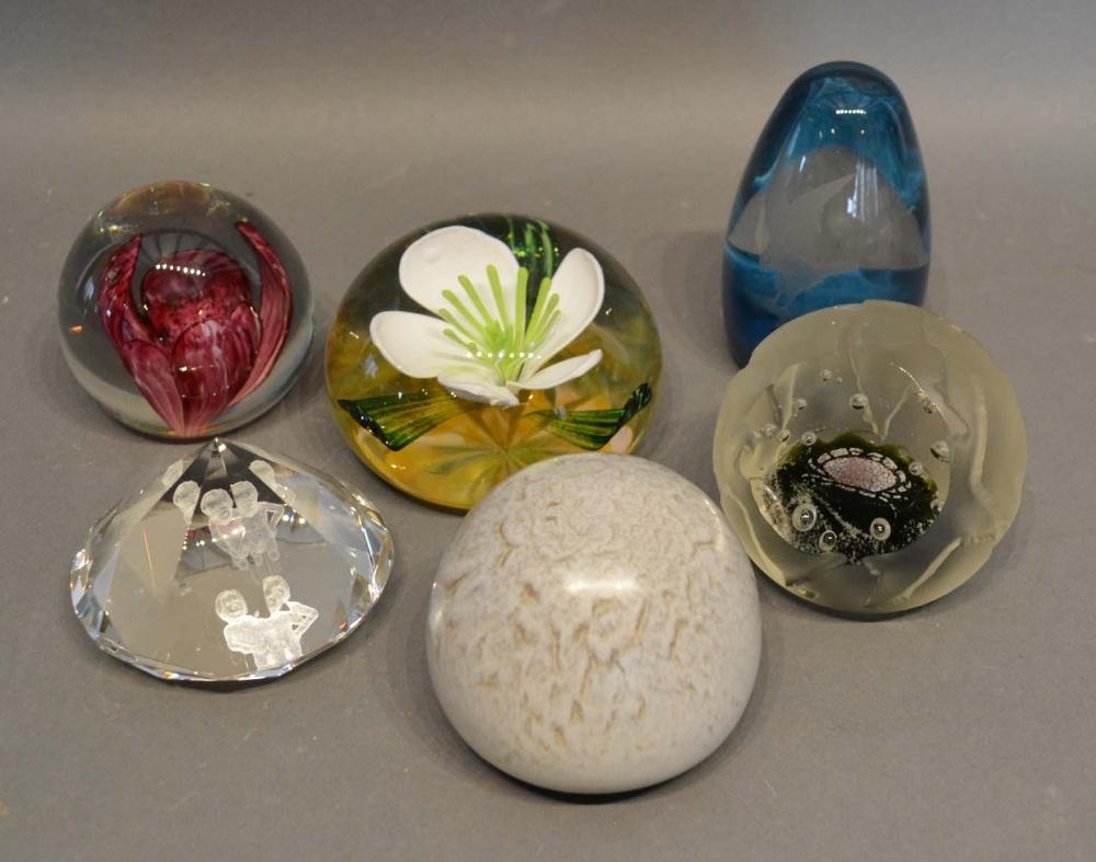 A Caithness Glass Paperweight, Winter Rose, 100/500, together with five other similar paperweights