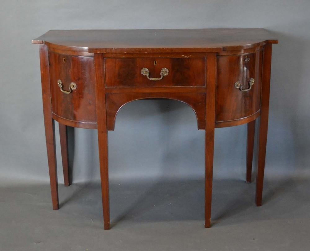 A 19th Century Mahogany Semi Bow-Fronted Serving Table of small proportions with a central drawer