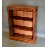 A Mahogany Dwarf Bookcase, the line inlaid top above open shelves raised upon a plinth, 74cm wide,