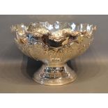 A Silver Plated Large Punch Bowl of embossed scroll form with circular pedestal base, 40cm diameter