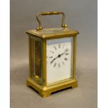 A French Brass Cased Carriage Clock, the enamel dial with Roman numerals and with lever escapement