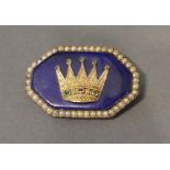 A 19th Century Yellow Metal Brooch of hexagonal form set with a crown on blue enamel with two