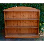 A 20th Century Pine Bookcase with open shelves, raised upon a plinth, 153cm wide, 29.5cm deep, 140cm