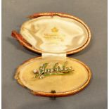 A Yellow Gold and Enamel Decorated Brooch commemorating the Jubilee set with a solitaire diamond,