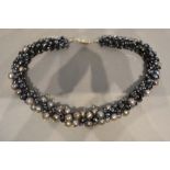 A Grey Pearl and Dark Crystal Choker with silver clasp