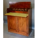 A Late 19th Century Mahogany Secretaire Cabinet, the moulded hinged top above a fitted secretaire,