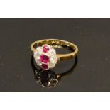 An 18 Carat Gold Ruby and Diamond Cluster Ring