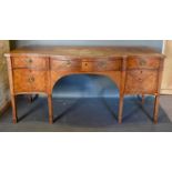 A 19th Century Mahogany Serpentine Fronted Sideboard, the moulded top above four drawers and a