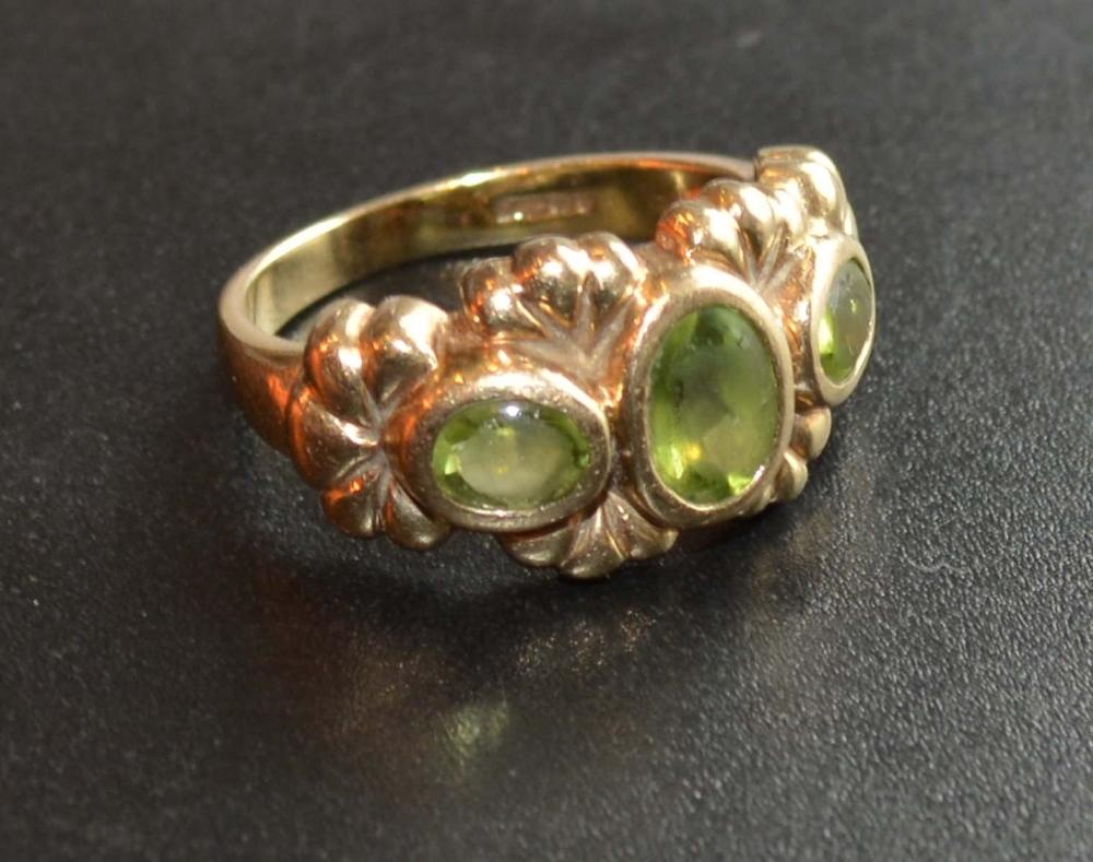 An 9 Carat Gold Ring set with three citrines