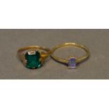 A 9 Carat Gold Dress Ring set green stone, together with another similar 9 carat gold dress ring,