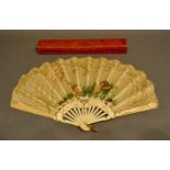 A 19th Century Fontage Fan, the satin hand-painted leaf depicting three putti within a landscape,