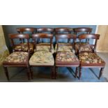 A Set of Eight William IV Mahogany Dining Chairs, each with a reeded rail back above a stuff over