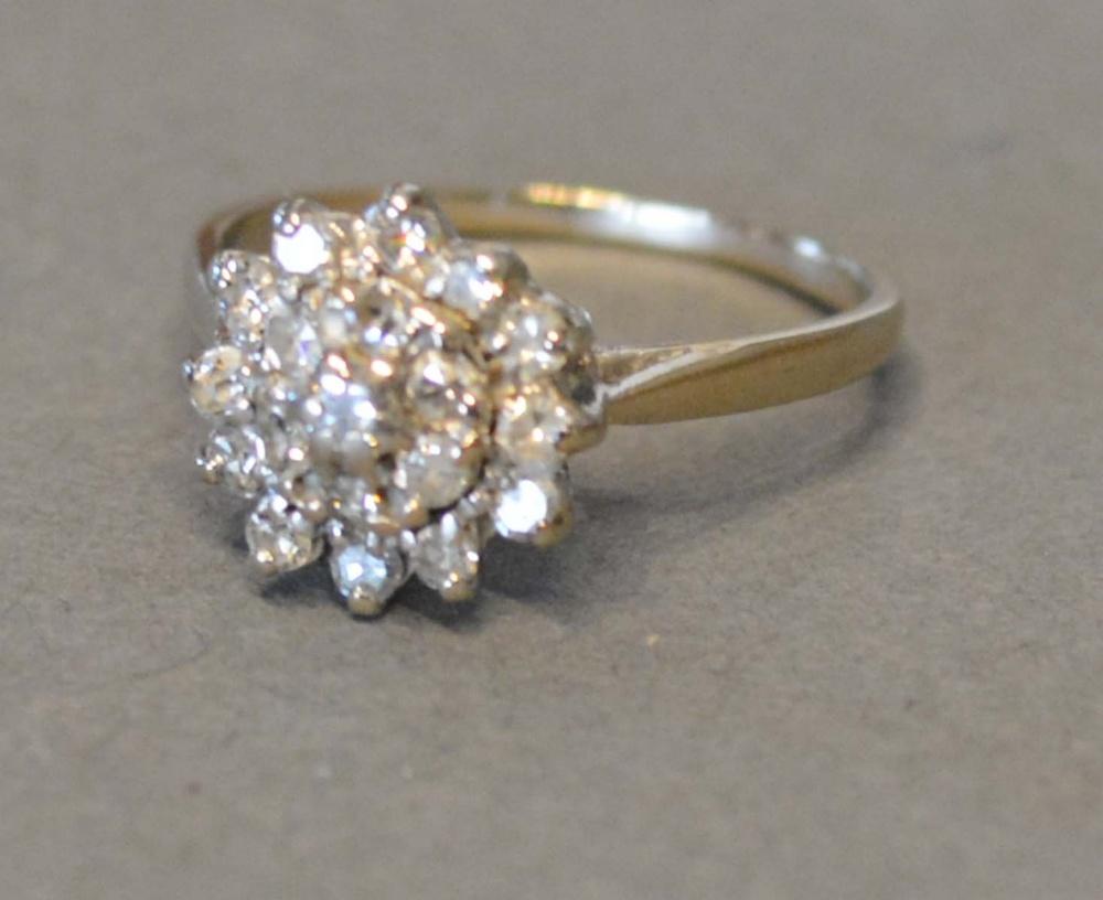An Unmarked White Gold Diamond Cluster Ring of Tiered Form, claw set