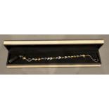 An 18 Carat Gold and Silver Bracelet by Links of London, in original box