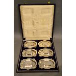 Six Silver Ashtrays with a set of six silver match cases within fitted lined case