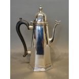 An Edwardian Silver Coffee Pot in the 18th century style of octagonal tapering form, London 1908,