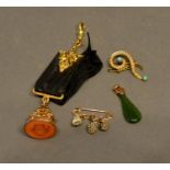 A 9 Carat Gold Seal Fob, together with two brooches and a small jade pendant