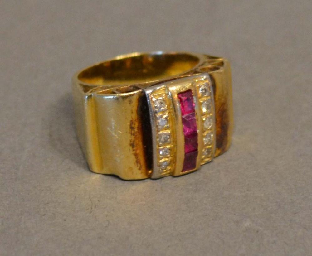 An 18 Carat Gold Cocktail Ring set with a band of rubies flanked by diamonds