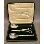 A George V Silver Grape Serving Set comprising a pair of spoons and a pair of grape scissors, London