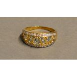 A 9 Carat Gold Pale Sapphire and Diamond Set Band Ring of pierced form