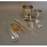 An 800 Mark Silver Christening beaker, together with an 830 silver eggcup, a silver napkin ring,