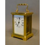A Brass Cased Carriage Clock, the enamel dial with Roman numerals and with lever escapement