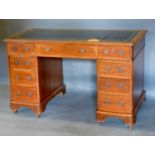 A 19th Century Mahogany Twin Pedestal Desk, the tooled leather inset top above nine drawers with