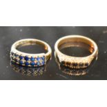 A 9 Carat Gold Sapphire Set Band Ring, together with another similar 9 carat gold sapphire dress