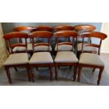 A Set of Eight Mahogany Rail Back Dining Chairs, the rail backs above stuff over seats raised upon