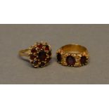 A 9 Carat Gold Garnet Set Cluster Ring, together with a similar 9 carat gold three stone garnet