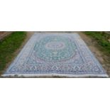 A North West Persian Woollen Carpet with a central medallion within an allover design upon a