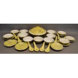 A Chinese Famille Rose Service with allover decoration upon a yellow ground comprising tureen,