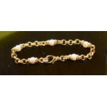 An 18 Carat Gold Linked Bracelet set with five pearls, maker OJ Perrin, 17.4 grammes