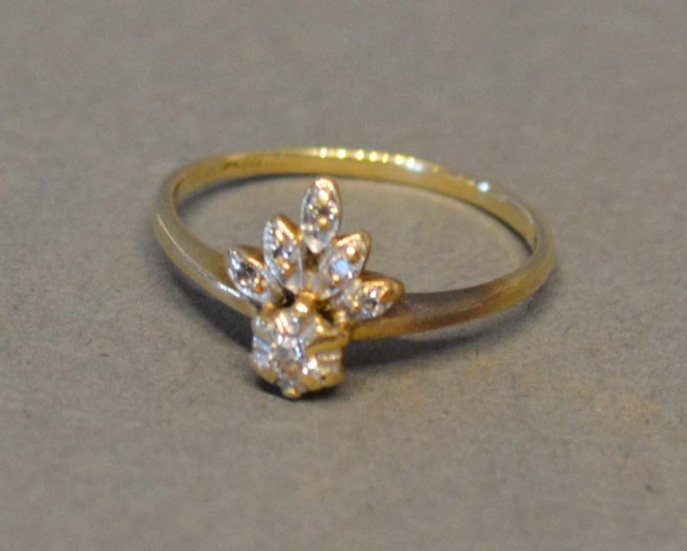 A 9 Carat Gold Dress Ring, diamond set, in the form of a fleur de lys