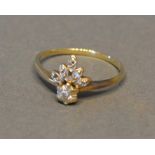 A 9 Carat Gold Dress Ring, diamond set, in the form of a fleur de lys